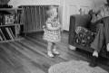Photograph: [Photograph of a baby in a living room]