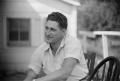 Photograph: [Photograph of George Stiles sitting outdoors]