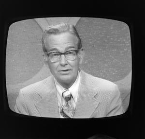 Primary view of object titled '[Newscaster on television]'.