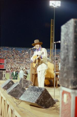 Primary view of object titled '[Hank Williams Jr. performing at WBAP's Country Gold 1974 anniversary event, 2]'.