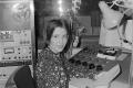 Photograph: [Photograph of Gaye Smith in a radio studio]