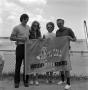 Photograph: [Art Davis' family with a WBAP flag]