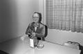 Photograph: [Marshall Atwell's stand-in at a table]