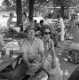 Photograph: [A couple sitting at a picnic table]