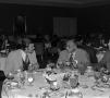 Photograph: [Photograph of many individuals dining at an event]