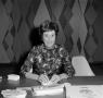 Photograph: [Unknown woman at a desk]