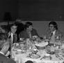 Photograph: [Photograph of five men dining at an event]