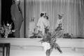 Photograph: [Photograph of children walking across the stage at a graduation cere…