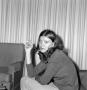Photograph: [A woman holding a cigarette]