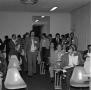 Photograph: [Photograph of a crowded room at an event]