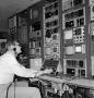 Photograph: [KXAS employee working in the control room]