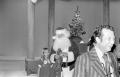 Photograph: [Harold Taft and Santa at a Christmas party]