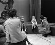 Primary view of [Photograph of Bill Kelley talking to a little boy at a KXAS Christmas Children's Hour party]
