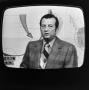 Photograph: [Harold Taft on a television screen]