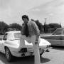 Photograph: [Don Shores posing with a car]