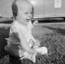 Primary view of [Photograph of baby Paul sitting in the grass]
