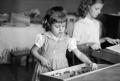 Photograph: [Photograph of Pam and Carol Williams playing as children]