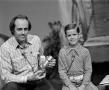 Photograph: [Photograph of Bill Kelley with a young boy]
