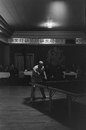 Primary view of object titled '[Photograph of a man playing ping-pong, 2]'.