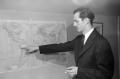 Photograph: [Byrd III pointing at a map]
