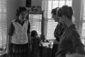 Photograph: [Harriet, Carol and Mary in a room]