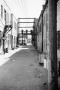 Photograph: [Photograph of an alleyway between brick buildings]