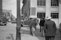 Photograph: [Photograph of individuals crossing a city street]
