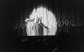Photograph: [Photograph of a magician performing on stage]