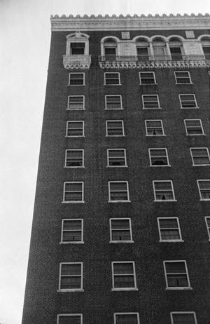 Primary view of object titled '[Photograph of a tall brick building]'.