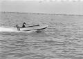 Photograph: [Photograph of an individual in a motorboat]