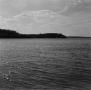 Photograph: [Photograph of a body of water under a cloudy sky]