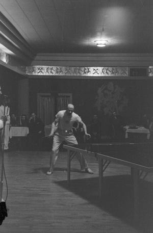 Primary view of object titled '[Photograph of individuals watching a ping pong match]'.