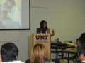 Image: [Anita Ahmed speaking during presentation at APAEC]