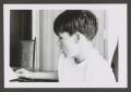 Photograph: [Photograph of a young boy at a table]
