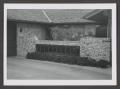 Photograph: [Photograph of the exterior of a brick house]