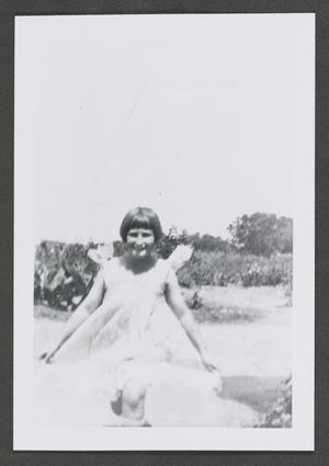 Primary view of object titled '[Photograph of a girl running outside]'.