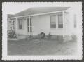 Photograph: [Front of a small house]