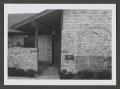 Photograph: [Photograph of the front of a brick house]