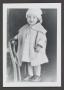 Photograph: [Photograph of a little girl standing on a chair]