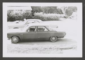 Primary view of object titled '[Photograph of three parked automobiles]'.