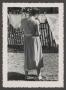 Photograph: [Photograph of Doris Stiles Williams hanging clothes on a line, 2]