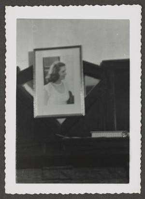 Primary view of object titled '[Framed photograph on a wall]'.