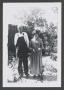 Photograph: [Photograph of an elderly man and woman posing outdoors]
