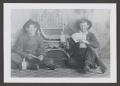 Thumbnail image of item number 1 in: '[Photograph of two men posing with guns and liquor bottles]'.