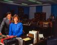 Photograph: [Photograph of Jane McGarry and a man posing together at a desk]