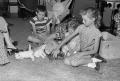 Photograph: [Tim, Pam and Carol playing with kittens, 2]