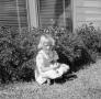 Photograph: [Harriet sitting in the grass]