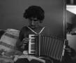 Photograph: [Doris playing an accordion]