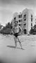 Photograph: [Charles Williams in a swimsuit at a beach]