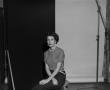 Primary view of [Doris sitting on a stool, in a studio, 3]